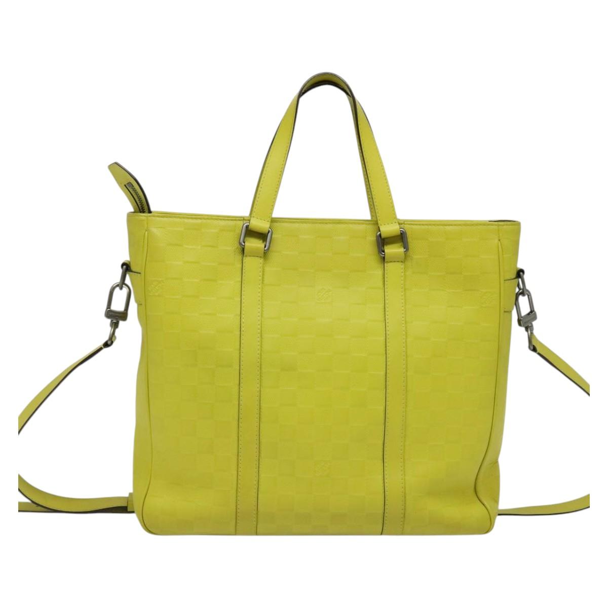 Louis Vuitton Tadao, Yellow, Leather, handbag