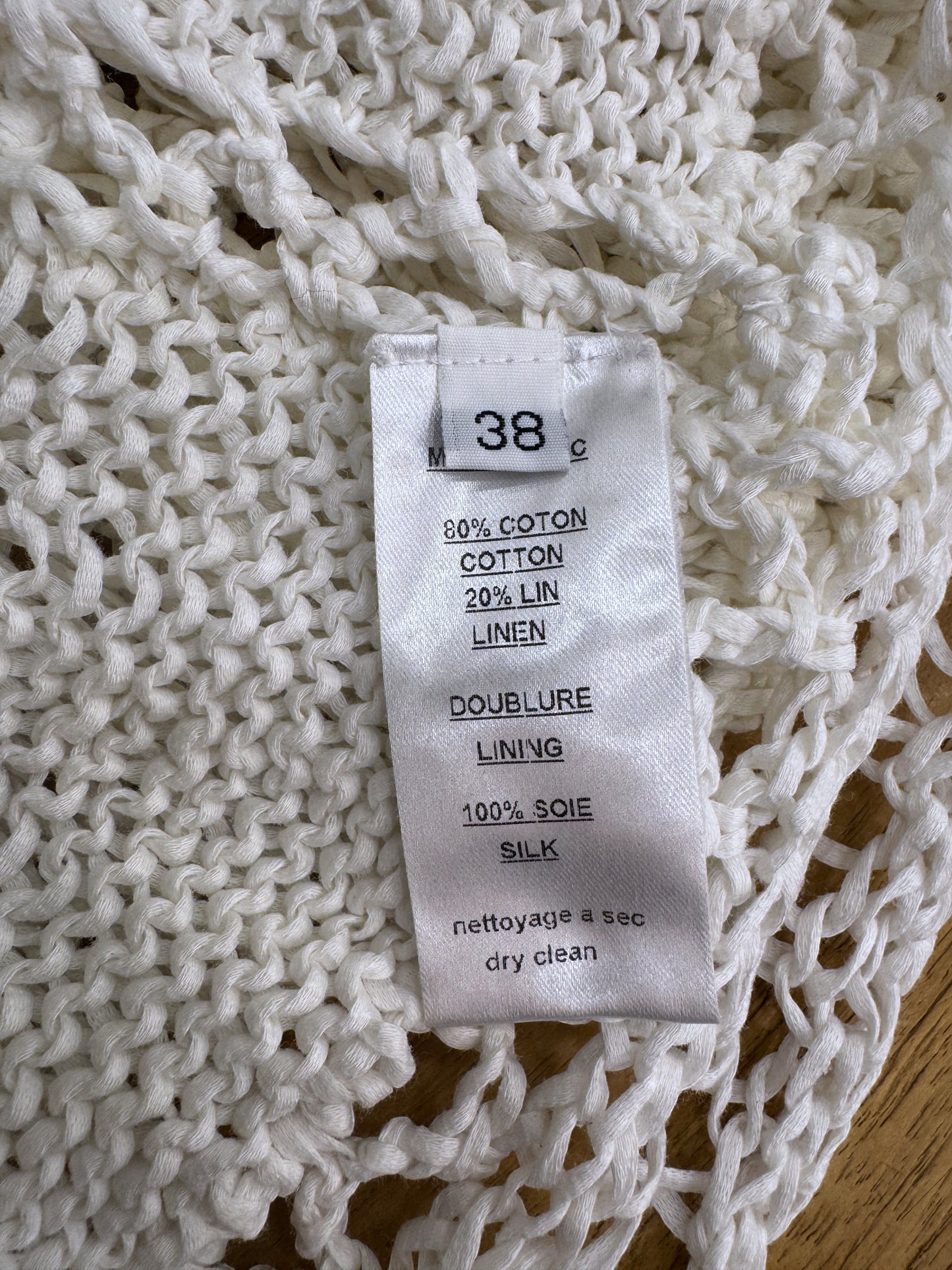 Brandsamsara Balmain white knitted dress care label showing cotton linen blend and silk lining composition