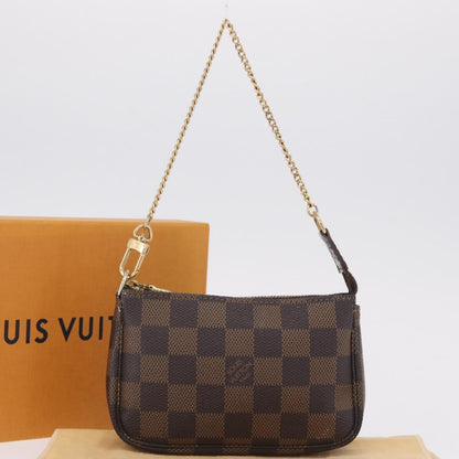 Louis Vuitton Mini pochette accessoires Damier Canvas, Brown, Canvas, Clutch