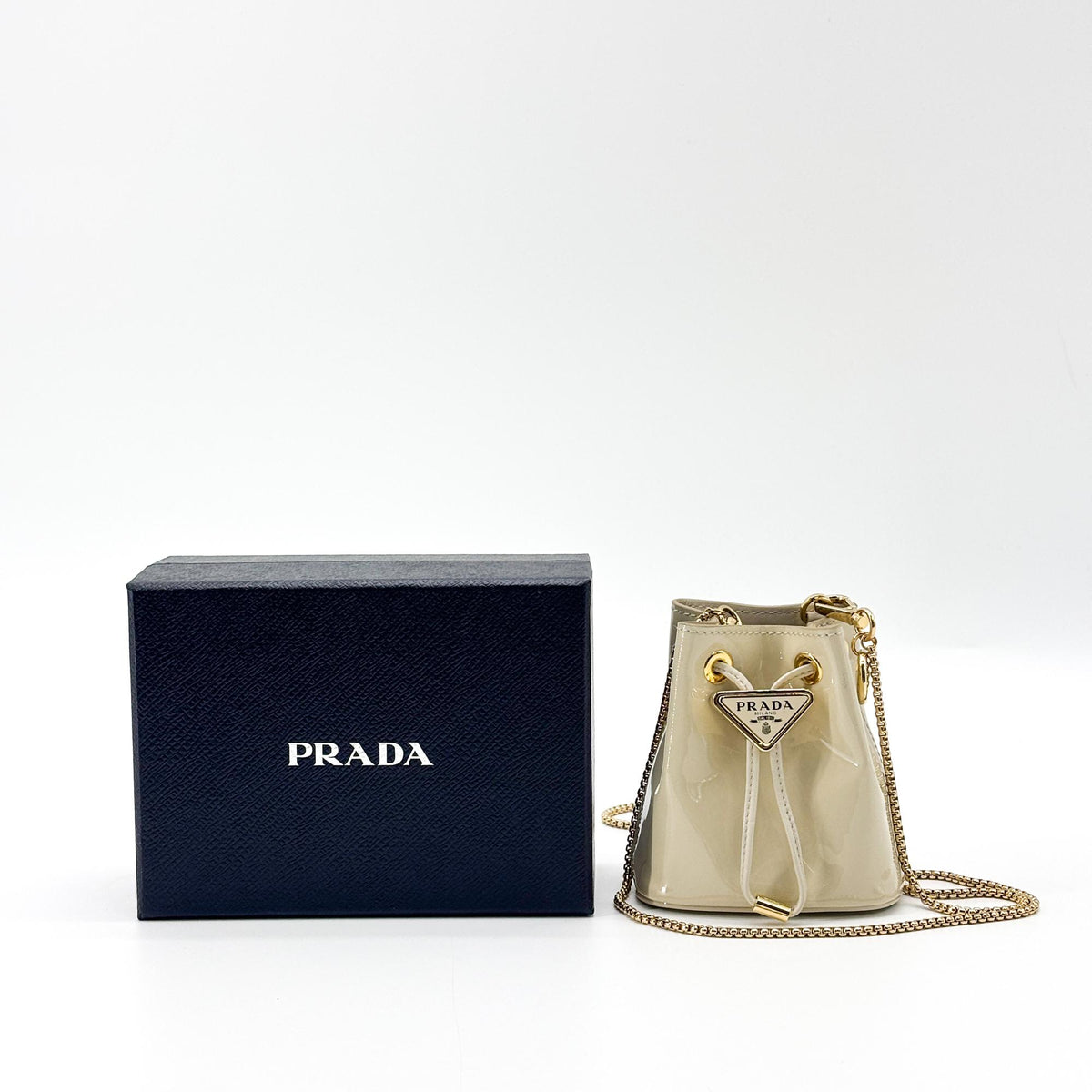 Prada Triangle Logo Drawstring Pouch Bucket Patent, Beige, Patent Leather, Clutch