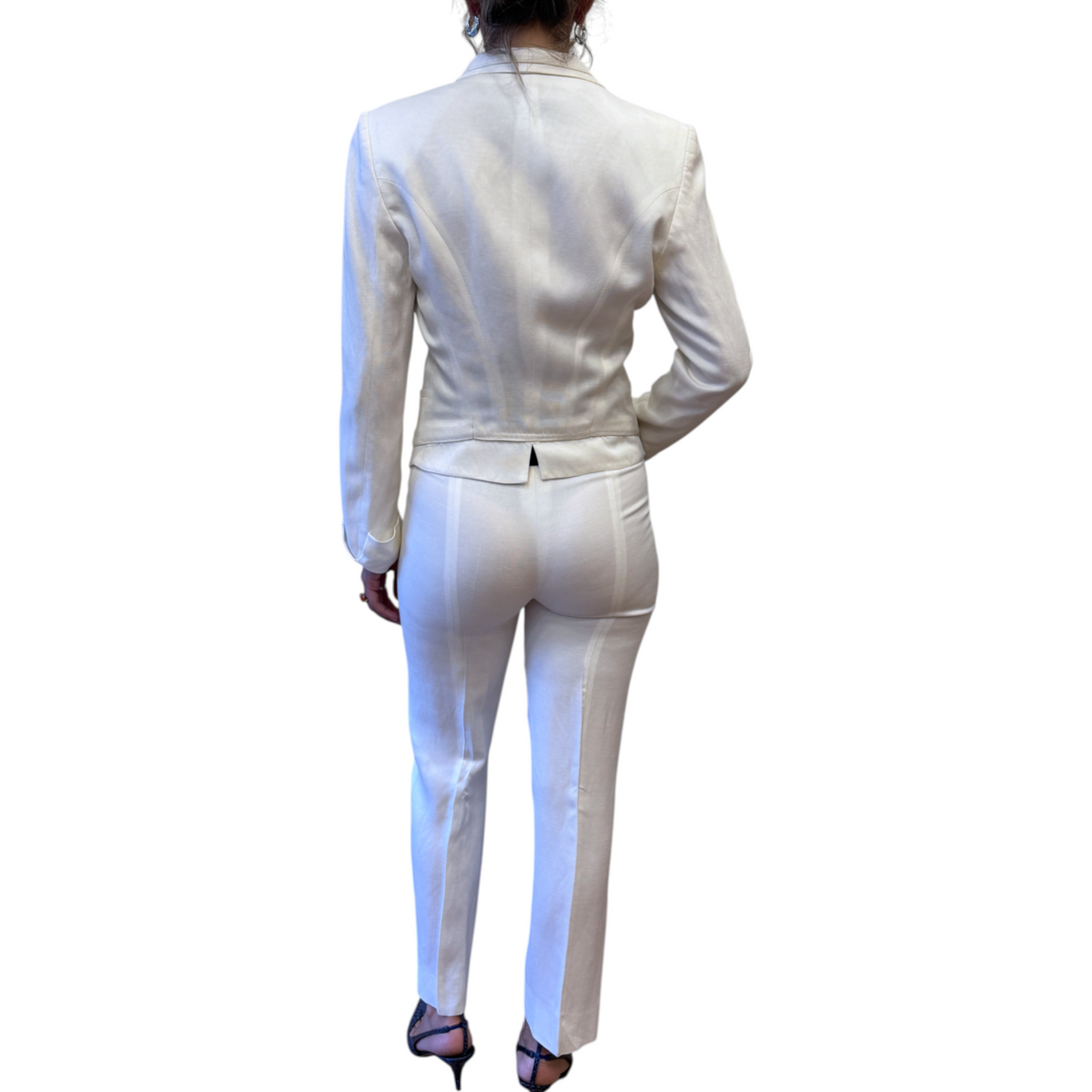 Brandsamsara white viscose and linen blend suit worn by a woman, back view showing tailored jacket and trousers.