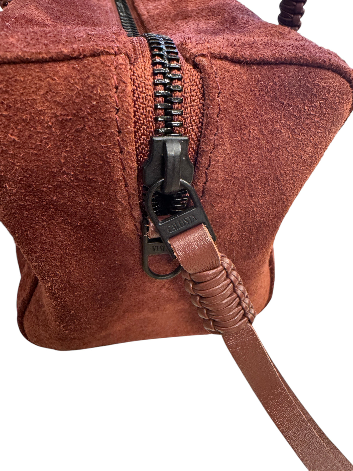 Brandsamsara Kallista brown suede leather handbag featuring a black zipper and braided leather pull detail