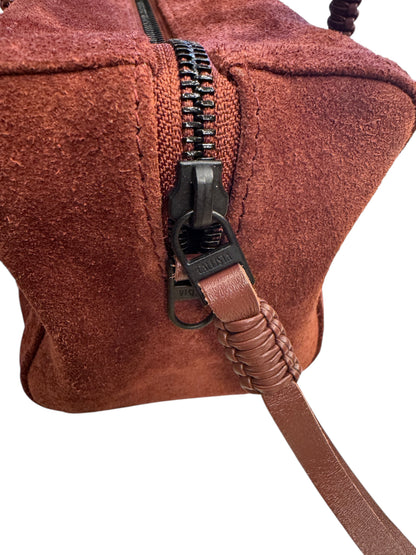 Brandsamsara Kallista brown suede leather handbag featuring a black zipper and braided leather pull detail