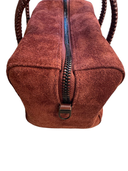 Brandsamsara Kallista brown suede leather handbag featuring a dark zipper closure and braided handles.