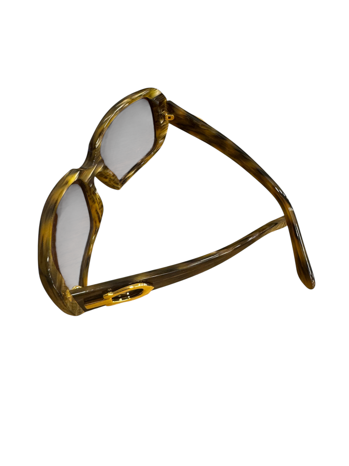 Brandsamsara Cartier sunglasses featuring a tortoiseshell acetate frame and medium tint lenses on a wooden surface