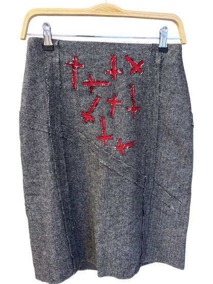 Brandsamsara Andy Warhol grey wool blend skirt with red embroidered cross details hanging on a wooden hanger