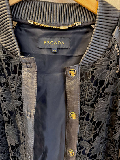 Brandsamsara Escada black leather jacket featuring intricate floral lace panels and gold-tone button details.