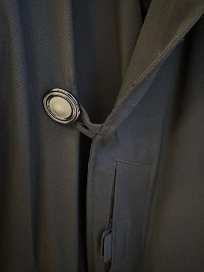 Brandsamsara Jean Paul Gaultier black coat featuring a prominent circular button and structured fabric detail