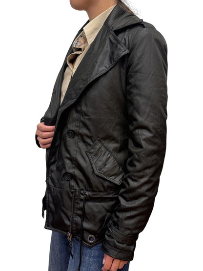 Brandsamsara black CNC Costume National long sleeve coat with button closure and side pockets worn by a model