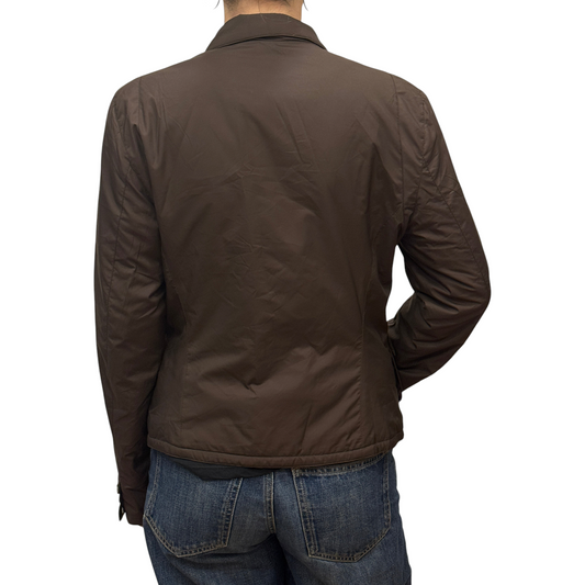 Back view of a Brandsamsara brown polyester lined jacket with long sleeves worn by a person