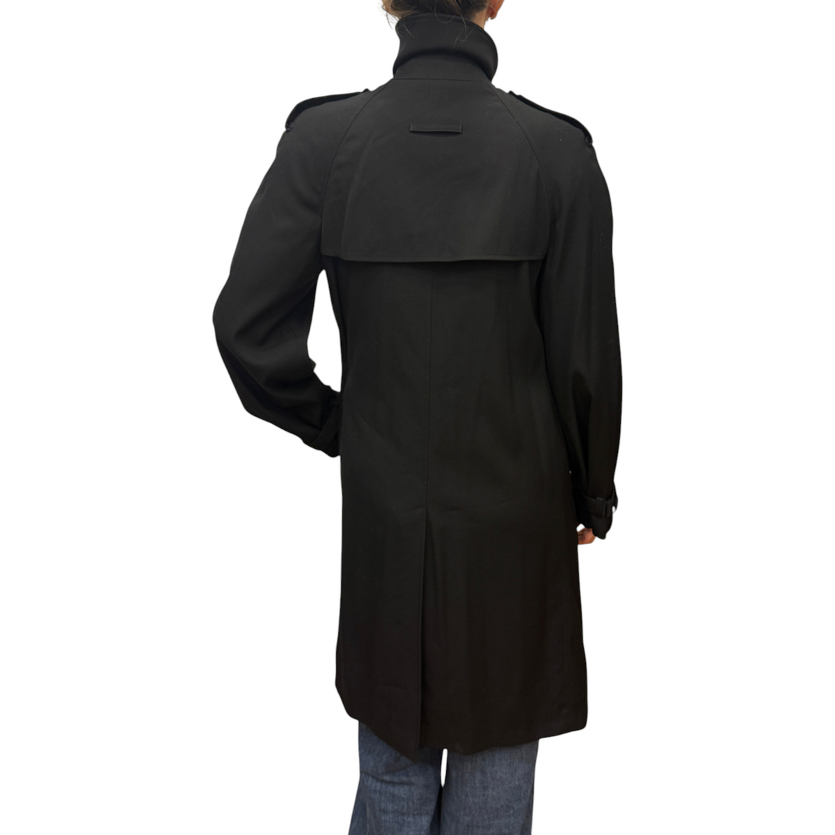 Brandsamsara Jean Paul Gaultier black trench coat with back storm flap and high collar, worn by a model