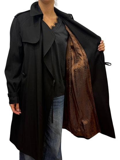 Brandsamsara Jean Paul Gaultier black trench coat with a brown script-patterned lining worn by a model