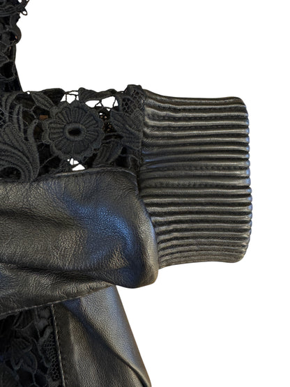 Brandsamsara Escada black leather jacket sleeve featuring intricate floral lace panels and ribbed cuff detail