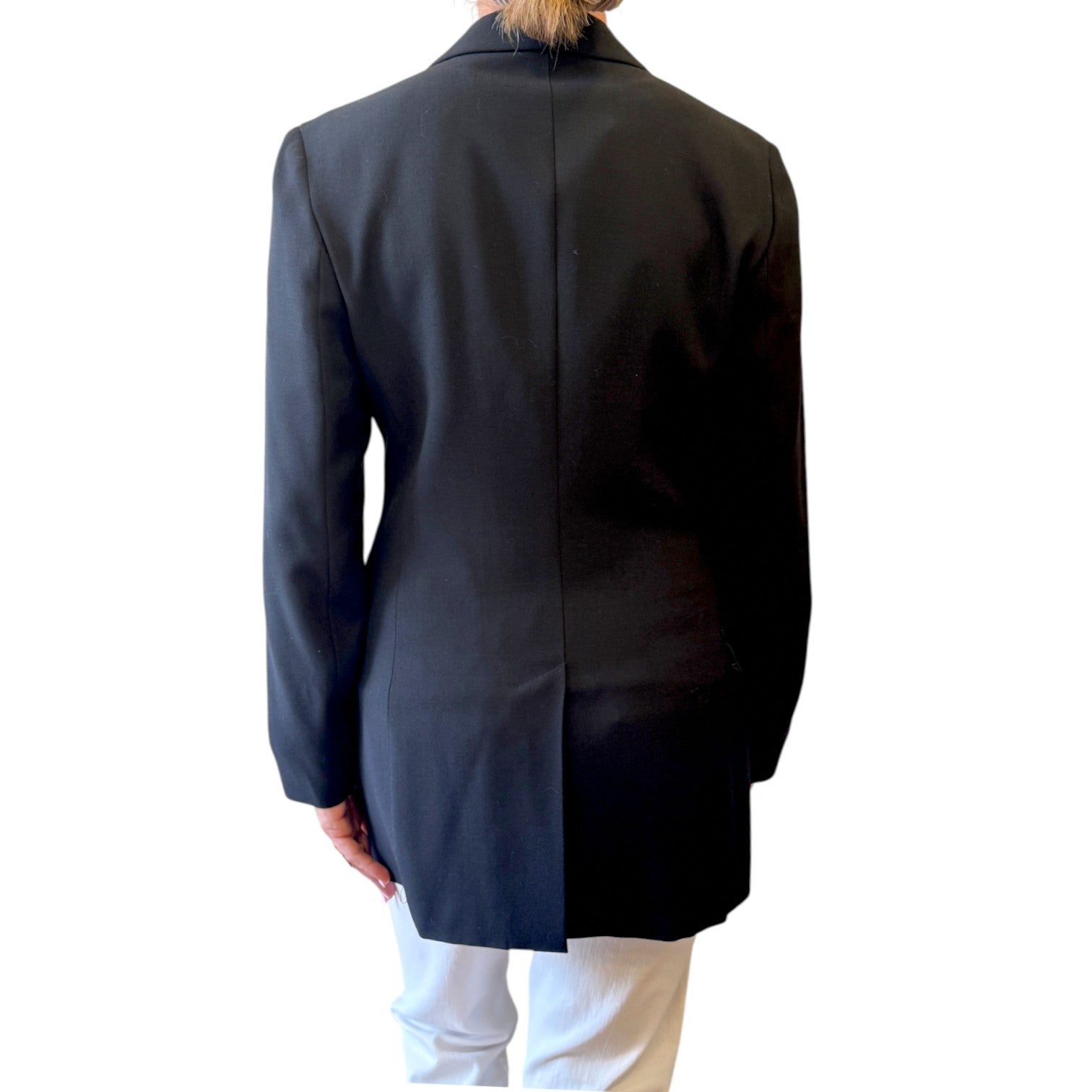 Back view of a black wool Max&Co jacket with long sleeves and a center back vent, worn by a model.