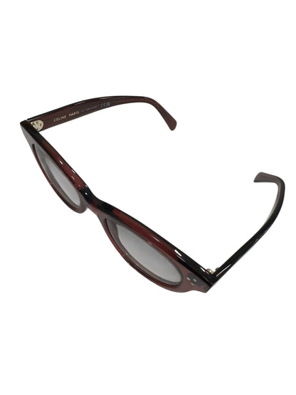 Brandsamsara Celine round-frame sunglasses in red acetate with three-dot temple hardware and gradient brown lenses.