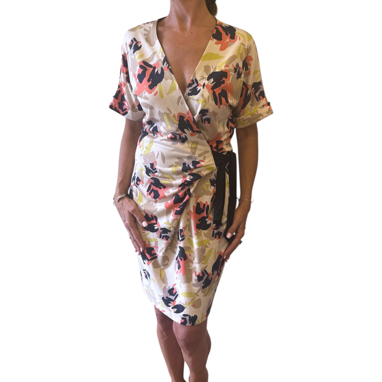 Brandsamsara Diane Von Furstenberg multicolor silk wrap dress with short sleeves worn by a model
