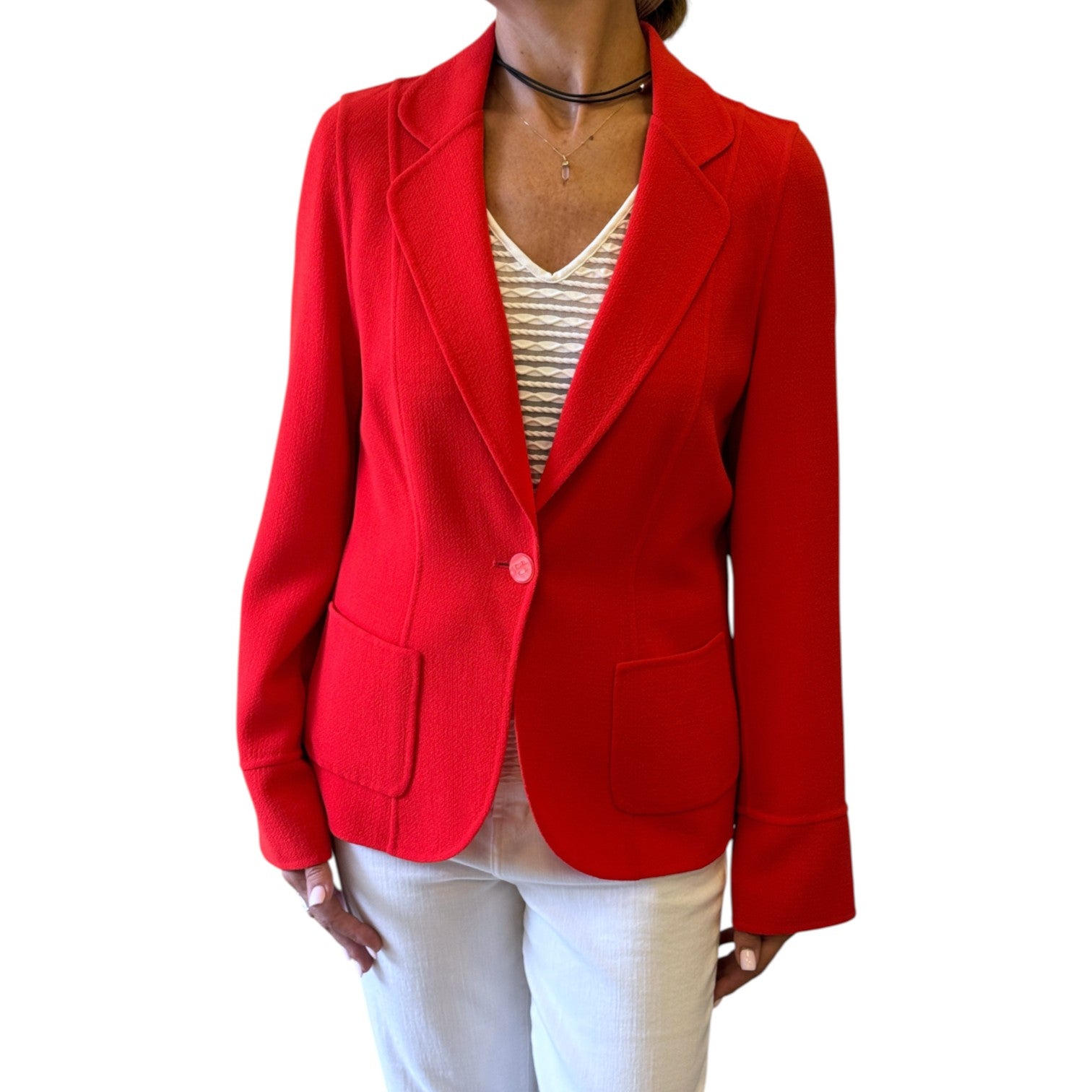 Brandsamsara Escada orange long sleeve blazer with notched lapels and front pockets worn by a woman