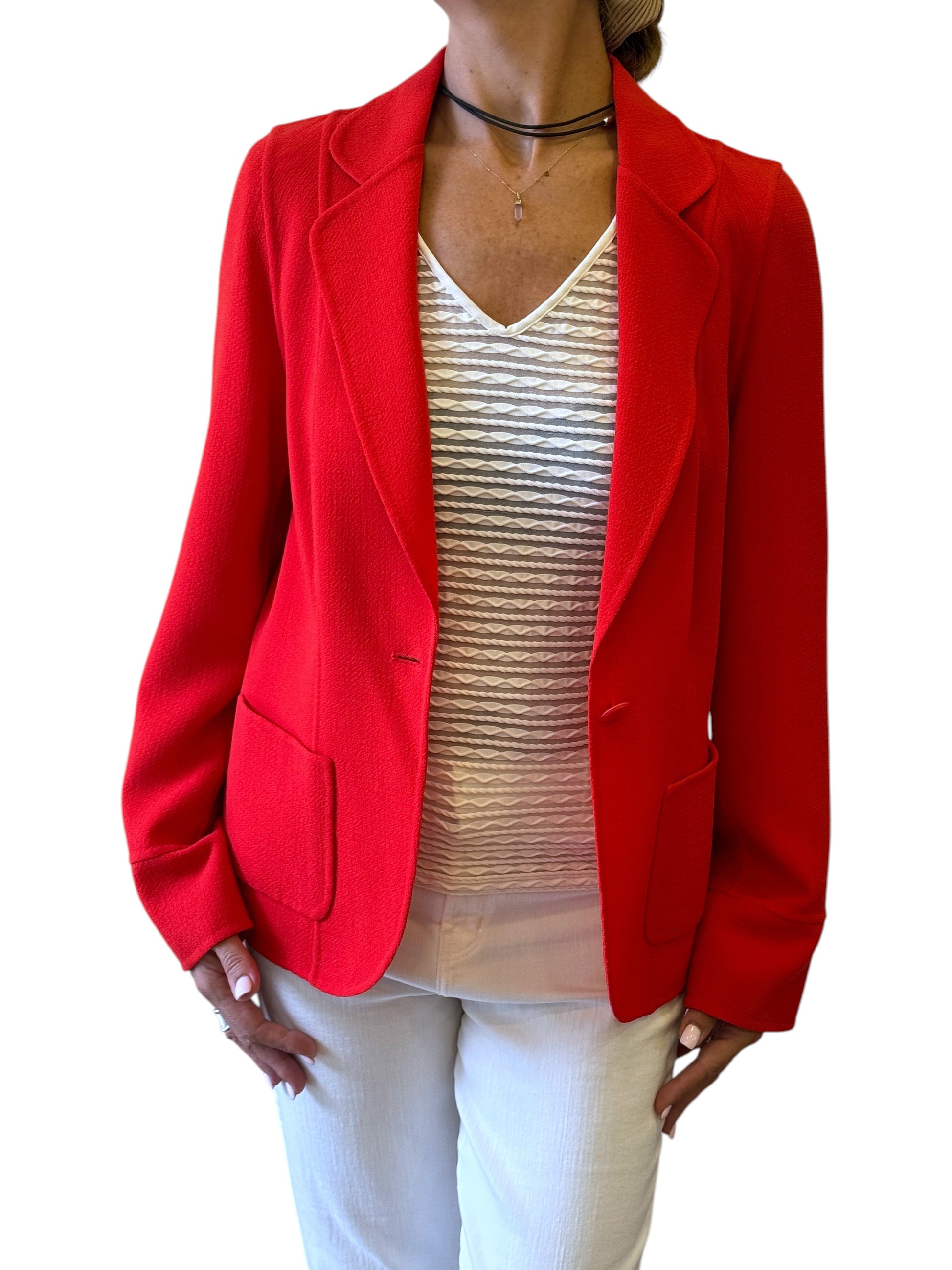 Brandsamsara Escada orange long sleeve blazer with patch pockets worn by a model