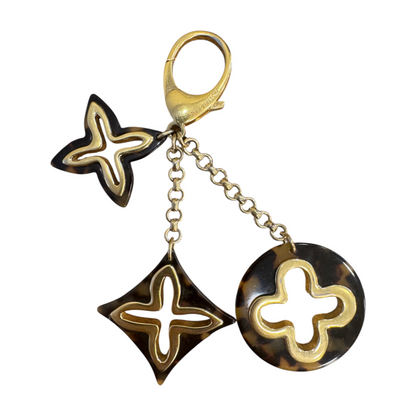 Brandsamsara Louis Vuitton Bijoux Sac Insolence bag charm in gold-tone brass and brown tortoise shell resin acetate