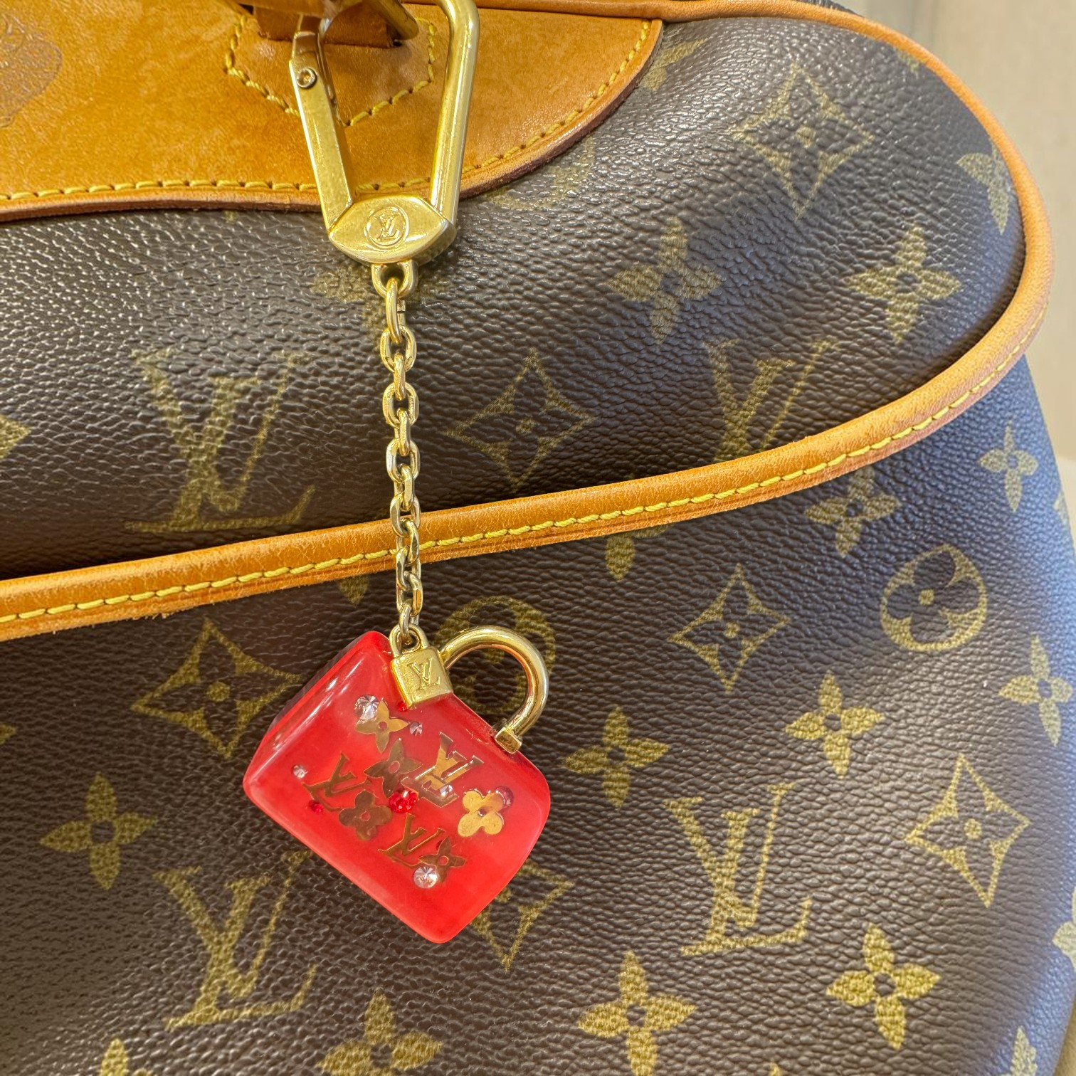 Brandsamsara Louis Vuitton red resin miniature Speedy bag charm with gold-tone hardware and monogram inclusions