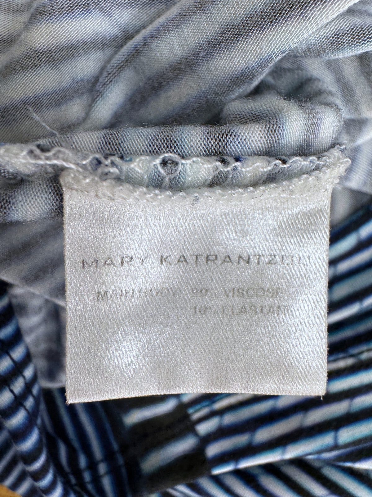 Brandsamsara Mary Katrantzou dress label showing 90 percent viscose and 10 percent elastane fabric composition