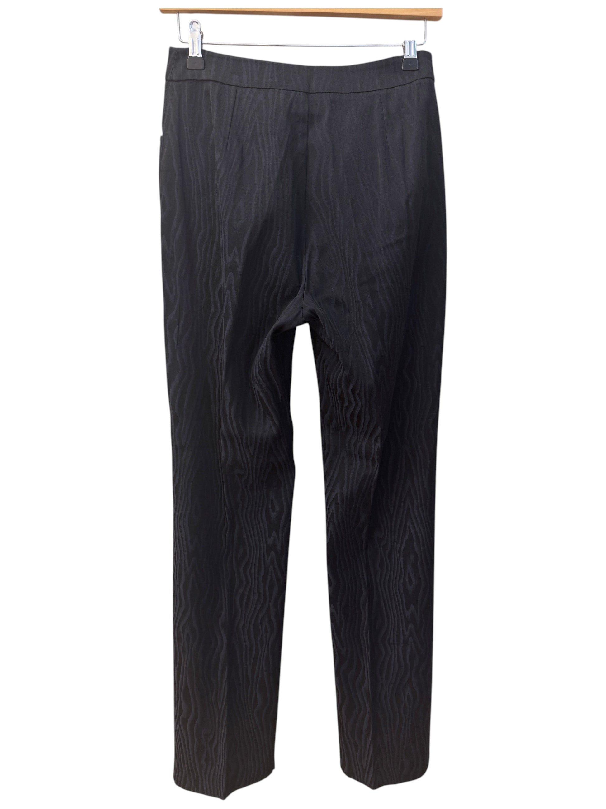 Brandsamsara Max & Co trousers in a black acetate blend with a subtle wavy textured pattern hanging on a hanger