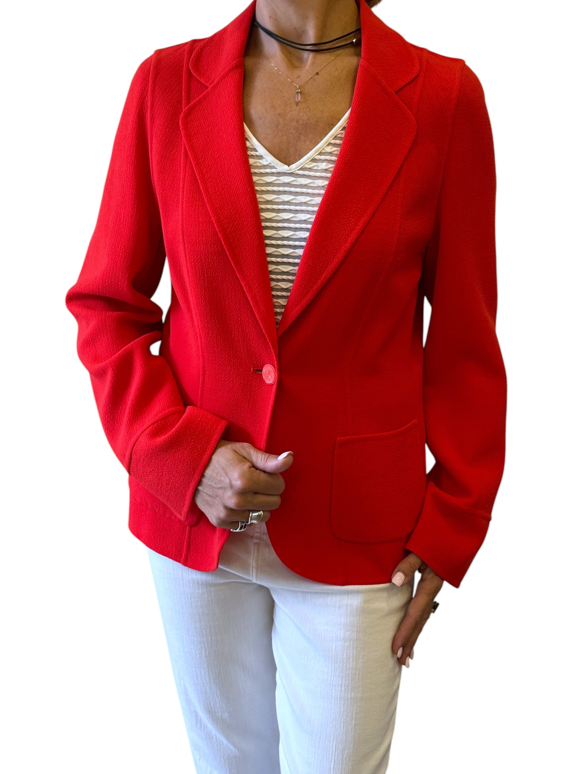 Brandsamsara orange Escada long sleeve jacket with a single button closure and front pockets worn by a model