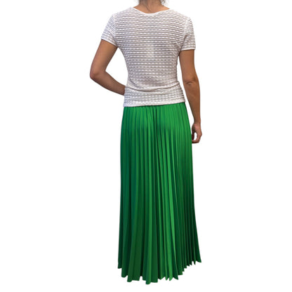 Brandsamsara P.A.R.O.S.H. green pleated maxi skirt worn with a white textured short-sleeve top, back view