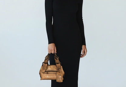 Brandsamsara tan leather shoulder bag with chain detail and embossed crocodile pattern. Features a zip pocket and luggage tag.