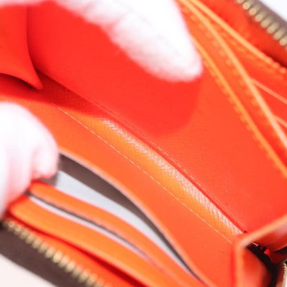 Louis Vuitton Porte-Monnaie Zippy Wallet monogramme empreinte, Orange, Canvas, Wallet