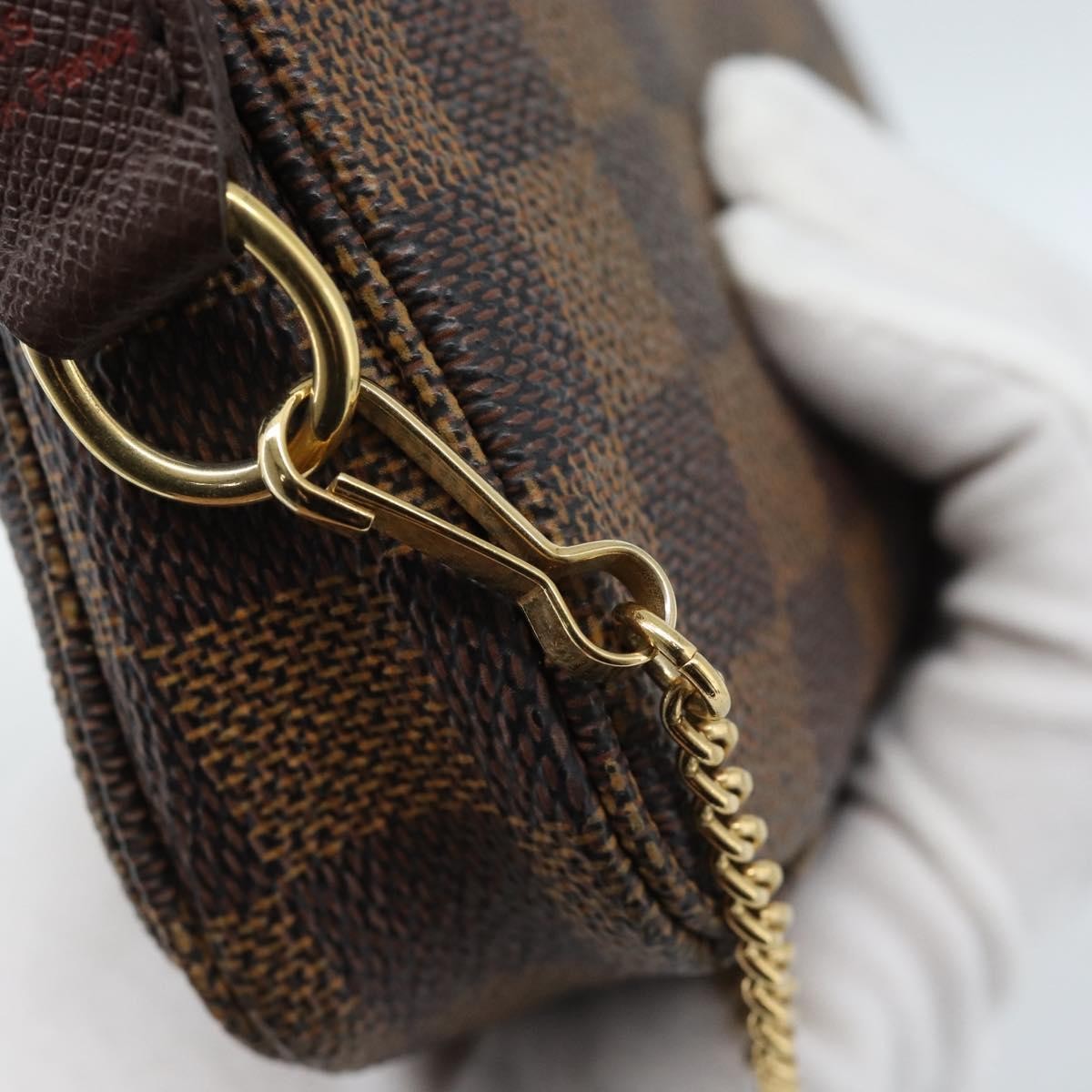 Louis Vuitton Mini pochette accessoires Damier Canvas, Brown, Canvas, Clutch