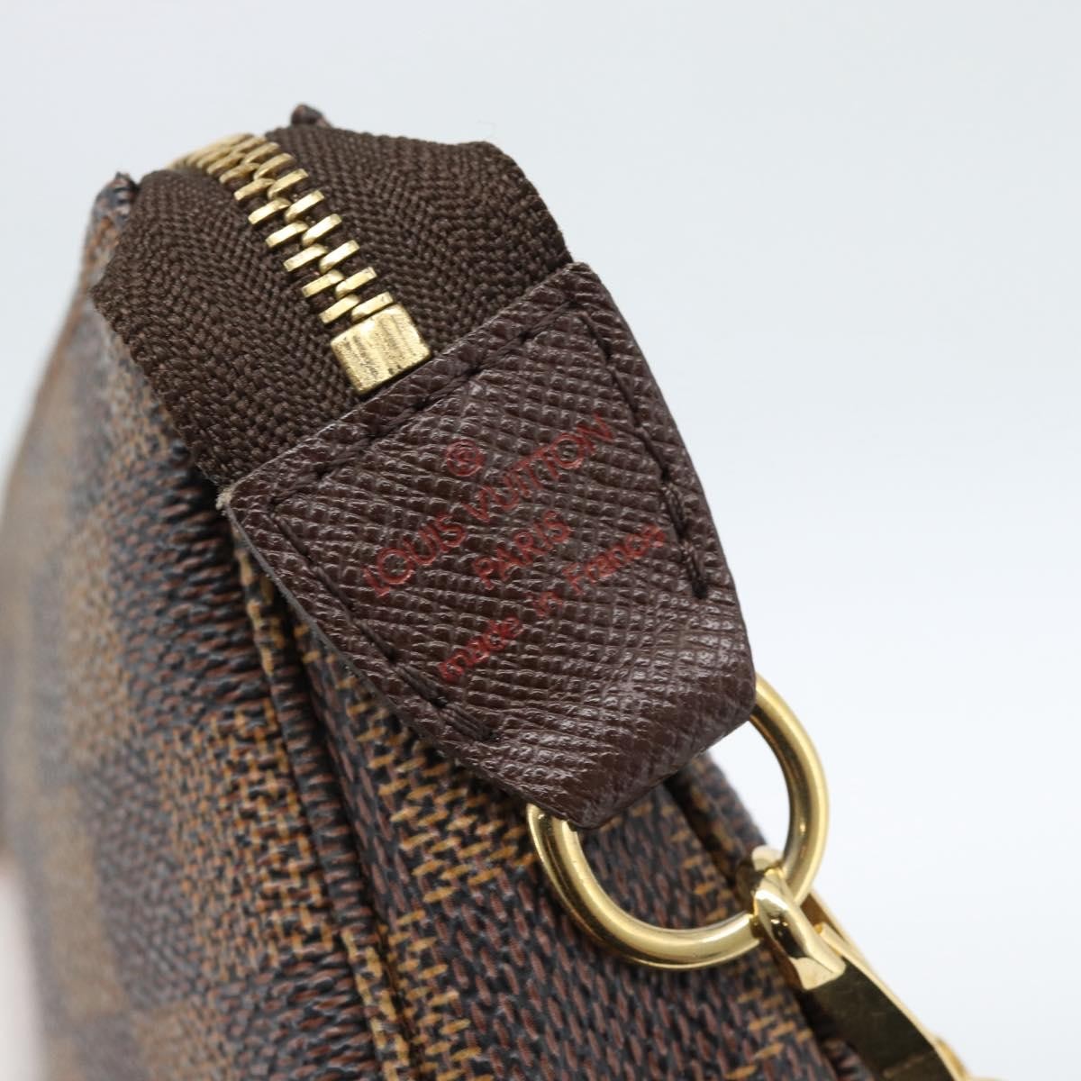 Louis Vuitton Mini pochette accessoires Damier Canvas, Brown, Canvas, Clutch