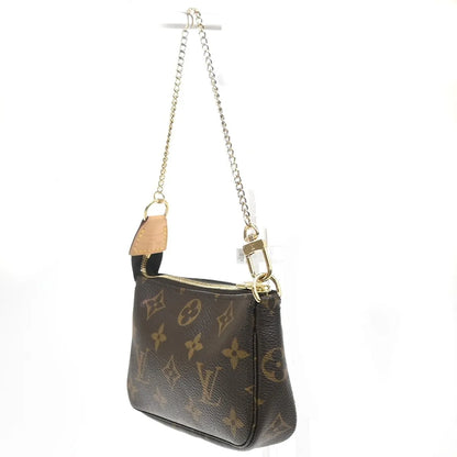 Louis Vuitton Mini pochette accessoires Canvas, Brown, Leather, Clutch